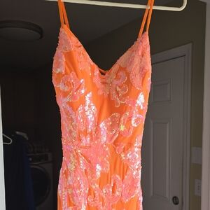 Stunning neon coral sequin formal gown by Midnight Doll. Spaghetti straps